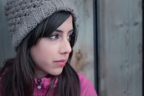 Young woman's profile looking lonely